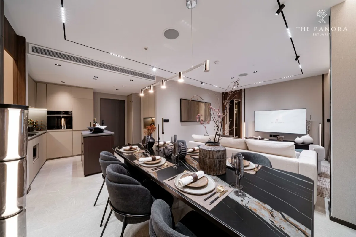 2 Bedroom Condo for Sale at Panora Estuaria open-plan living area with dining table, kitchen, and sofa.