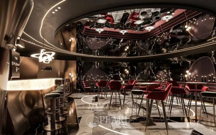 Embassy Pattaya 'The Diplomat Lounge' co-working space with tables, chairs, and modern decor.