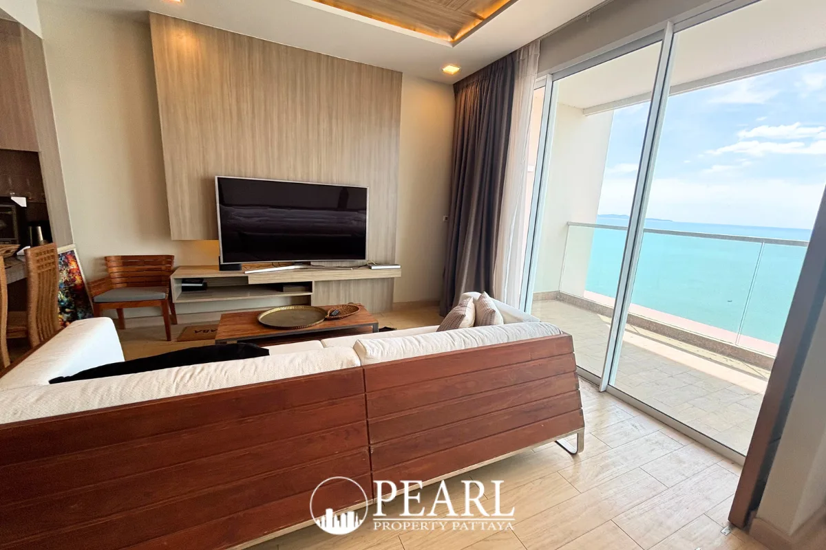 1 Bedroom Condo for Sale at Cetus Beachfront - private balcony with glass railing offering a panoramic ocean and sky view.